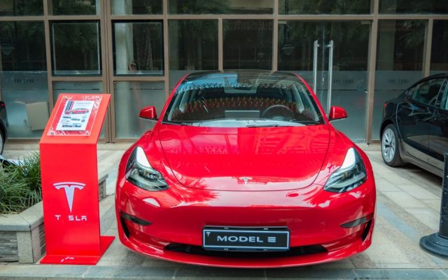Tesla Model 3 electric car parked on a Portuguese street