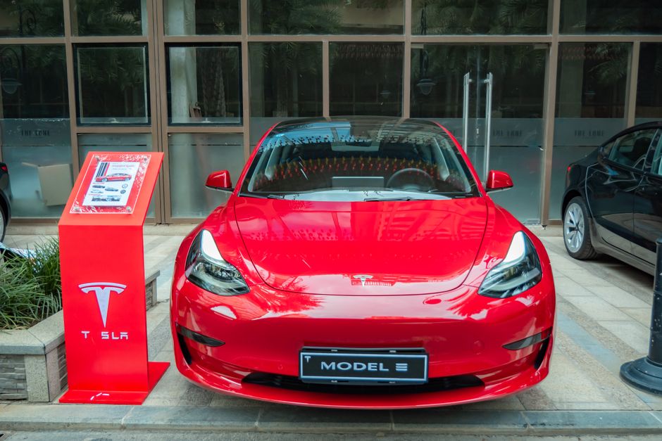 Tesla Model 3 electric car parked on a Portuguese street