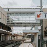 Intercidades train at a Portuguese station platform in summer