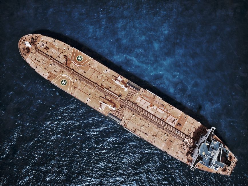 Naval patrol vessel shadowing an oil tanker at sea