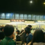 Travellers queuing at an airport border control checkpoint