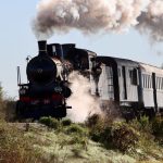 Historic steam train travelling through the Portuguese countryside
