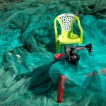 Discarded fishing nets piled at an Algarve port for recycling