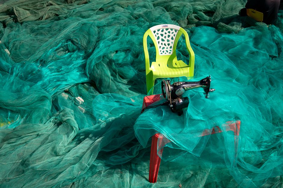 Discarded fishing nets piled at an Algarve port for recycling