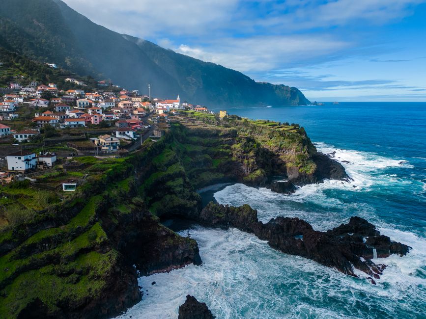 Aerial view of Madeira island coastline and hillside towns