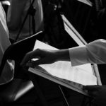 Young musicians and dancers rehearsing together in a studio