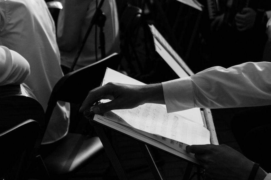 Young musicians and dancers rehearsing together in a studio