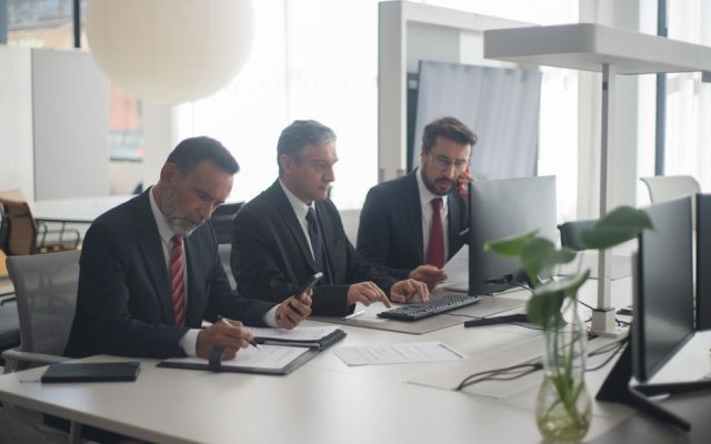 Foreign worker filling out paperwork at a Portuguese office