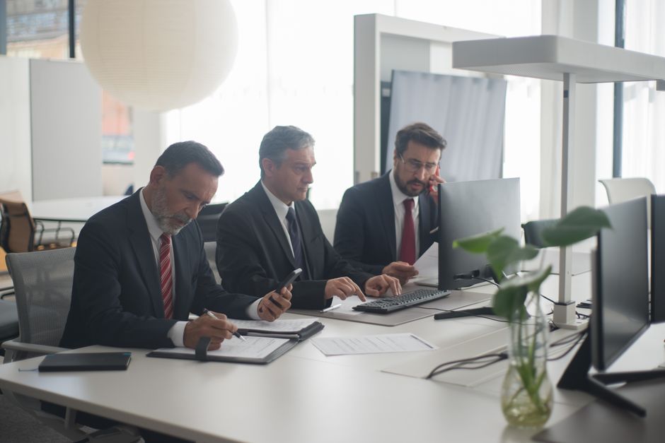 Foreign worker filling out paperwork at a Portuguese office