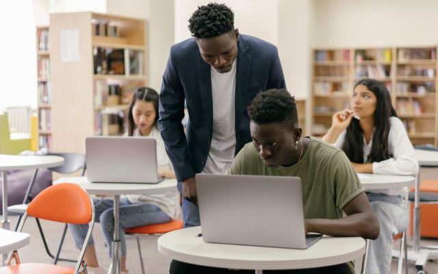 Students using laptops in a Portuguese classroom